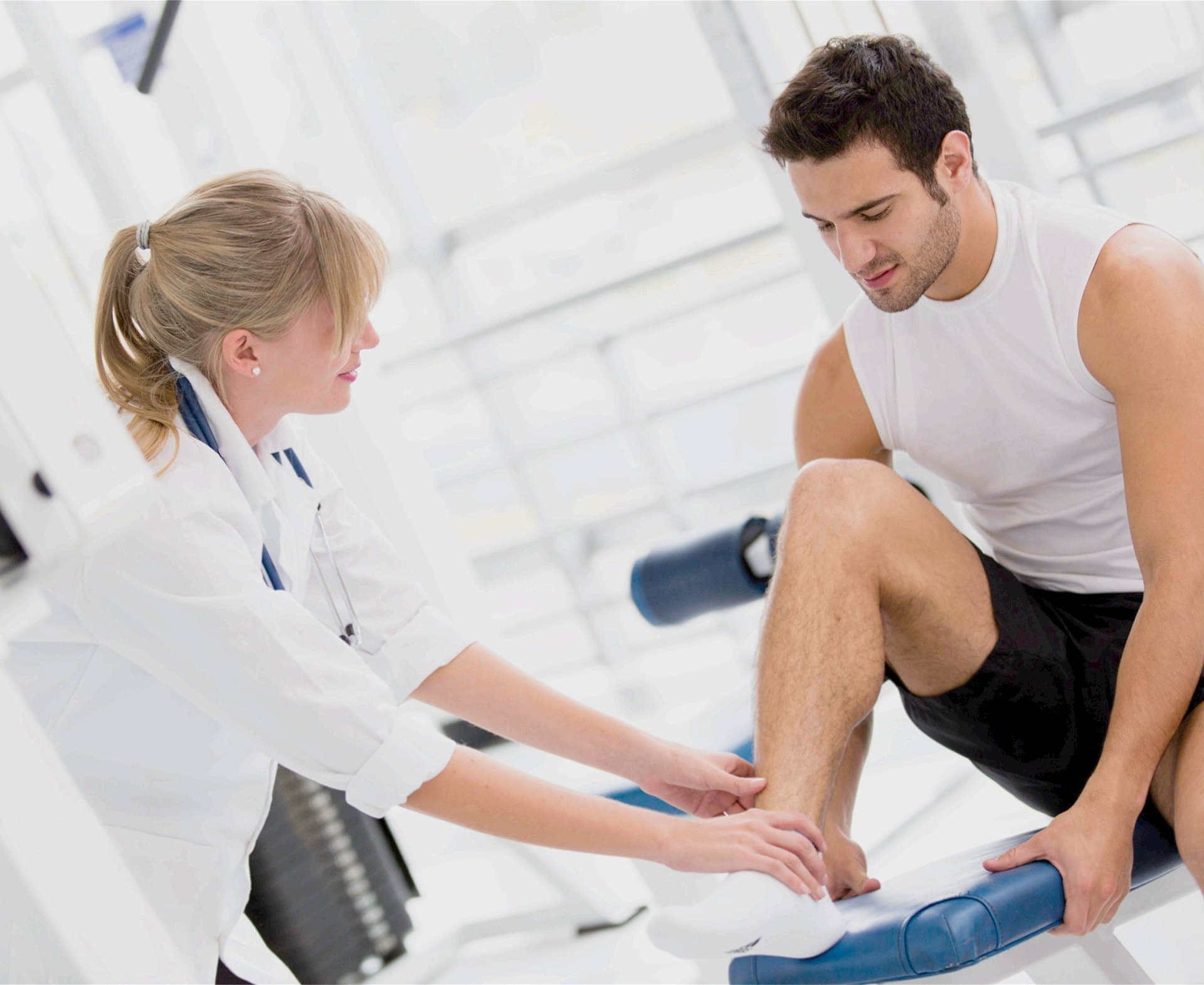 A clinician examining an athlete's lower leg